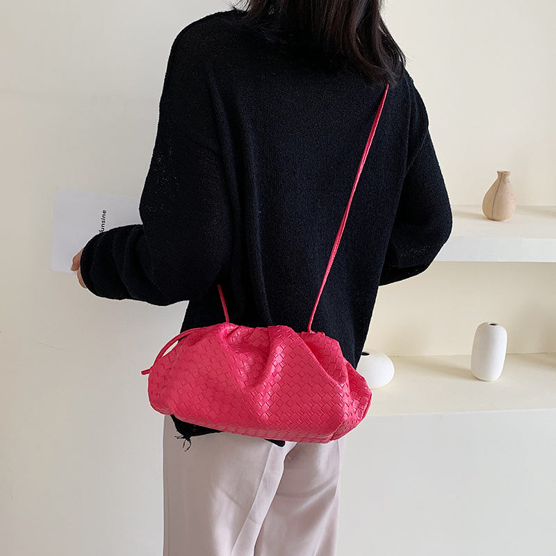 Hand holding diagonal cloud bag